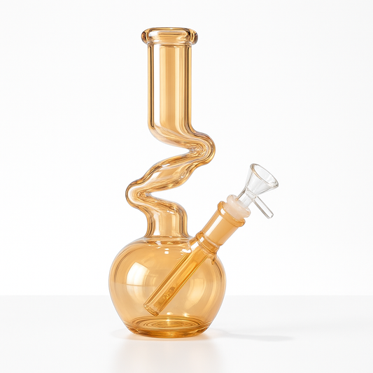 ZONG – 10” Zig-Zag Glass Waterpipe
SKU : 007
The ZONG 10” Waterpipe brings the iconic zig-zag silhouette to a compact, modern form. Its wavy neck design naturally cools smoke as it travels, creating smoother, more flavorful pulls with every hit. The rounded bubble base provides strong stability, while the vibrant colored glass gives each piece a bold, eye-catching finish.
⫸ Height: 10 inches
⫸ Material: Premium Borosilicate Glass
⫸ Design: Classic Z-shaped neck with bubble base